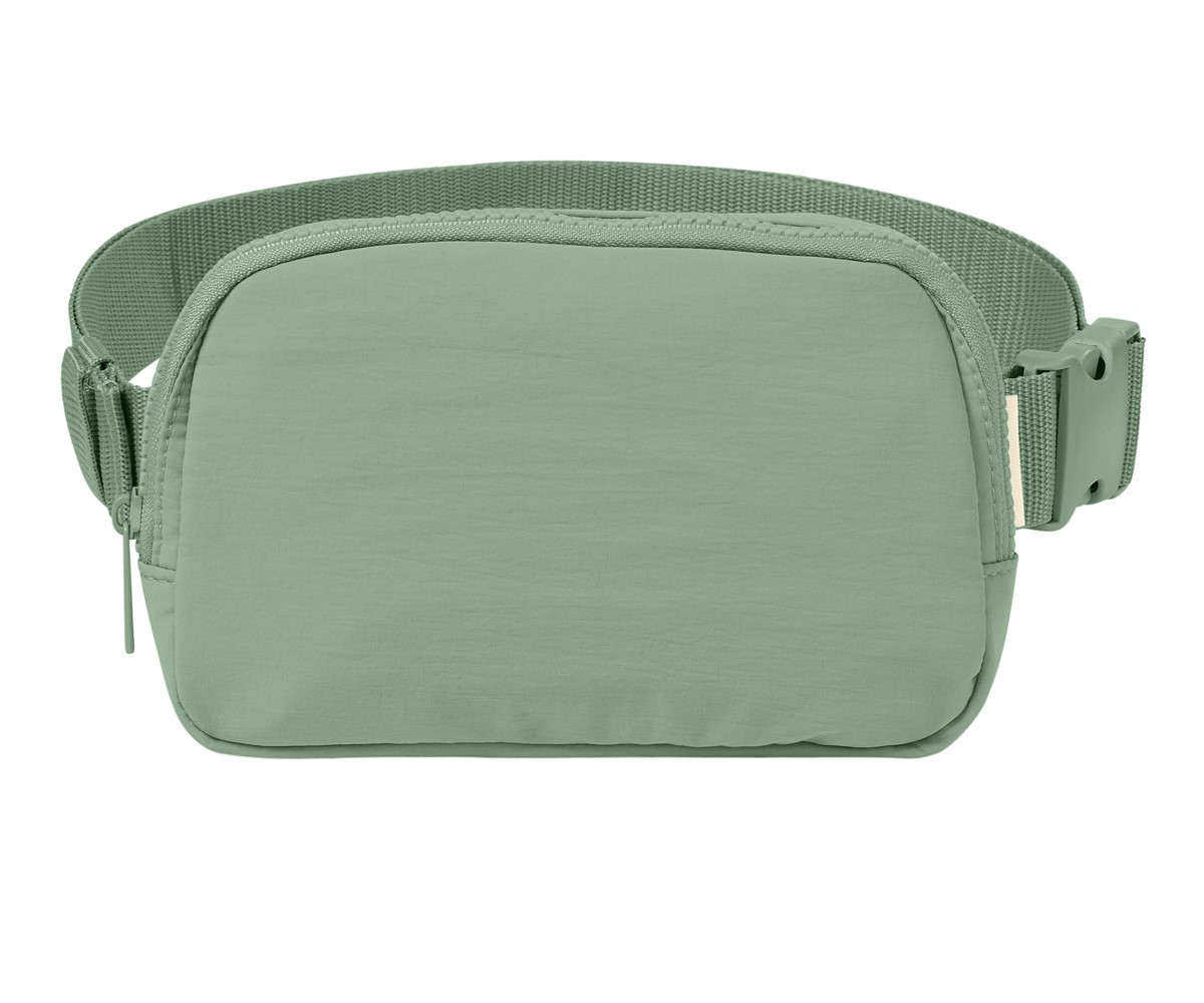 Person wearing a Bay Comfort Colors Explorer Sling Bag crossbody, showcasing its adjustable strap and compact everyday-carry design.