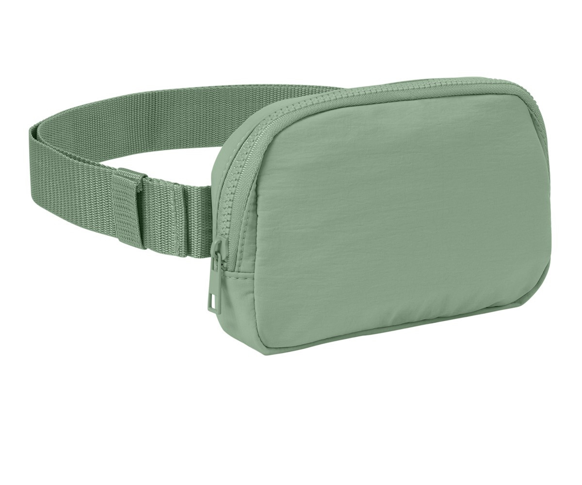 Person wearing a Bay Comfort Colors Explorer Sling Bag crossbody, showcasing its adjustable strap and compact everyday-carry design.