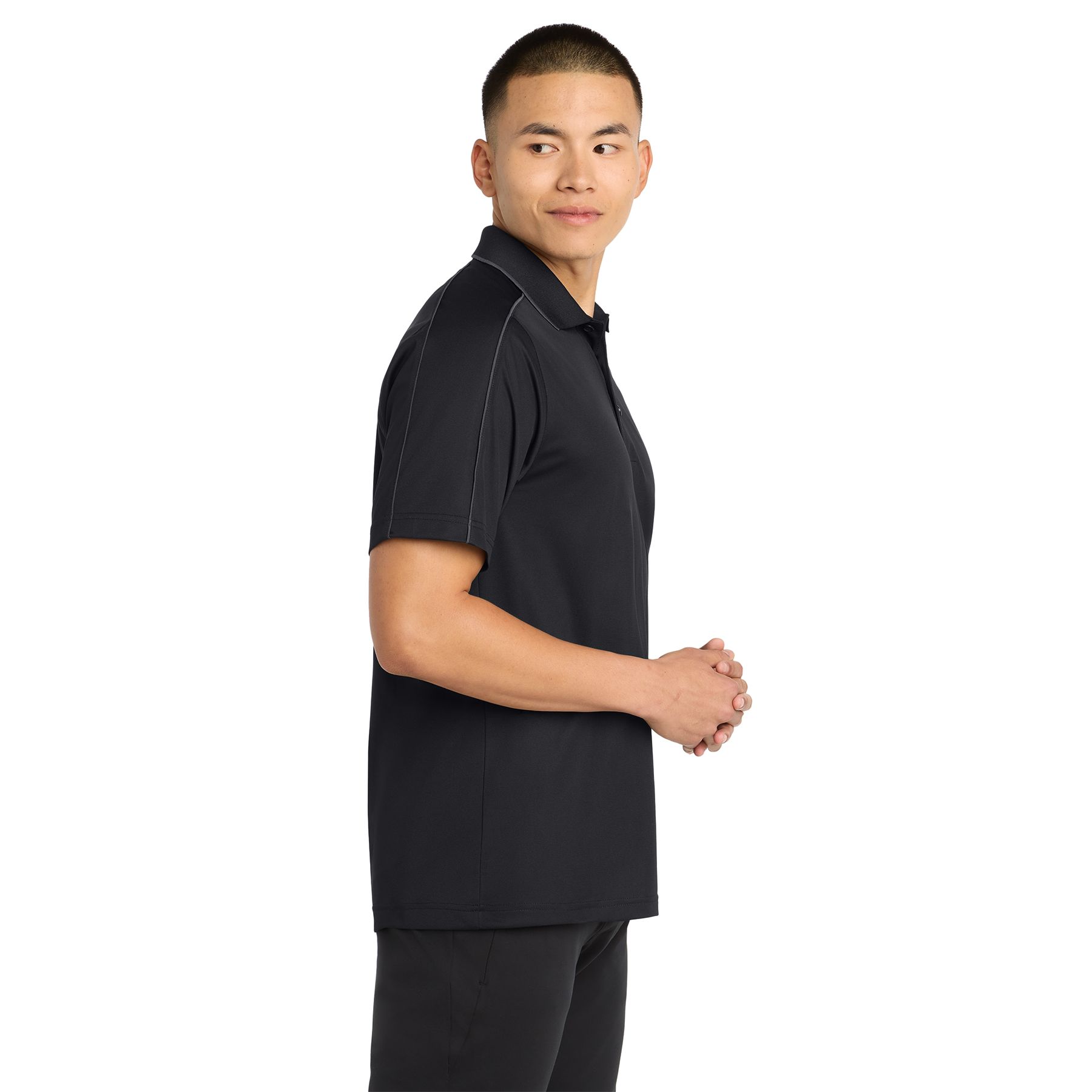 Side view of Black/Iron Gray Sport-Tek Micropique Sport-Wick Piped Polo in a solid athletic color with contrasting piping along the shoulders and sleeves, featuring a smooth polyester tricot fabric, three-button placket, flat knit collar, and sporty design for activewear or casual wear.