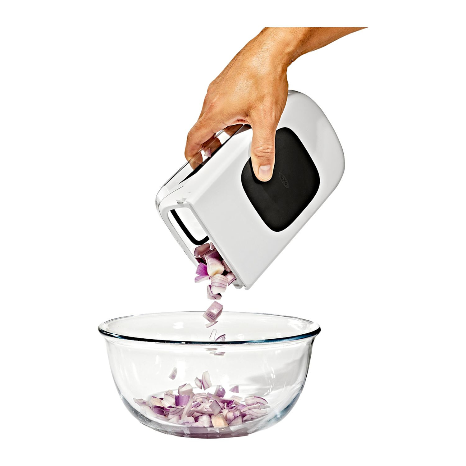 White OXO Good Grips Vegetable Chopper with Easy-Pour Opening, featuring a compact white and clear plastic container, black leverage-assist lid, and stainless steel chopping blades, designed for quickly chopping vegetables, fruits, onions, and peppers.