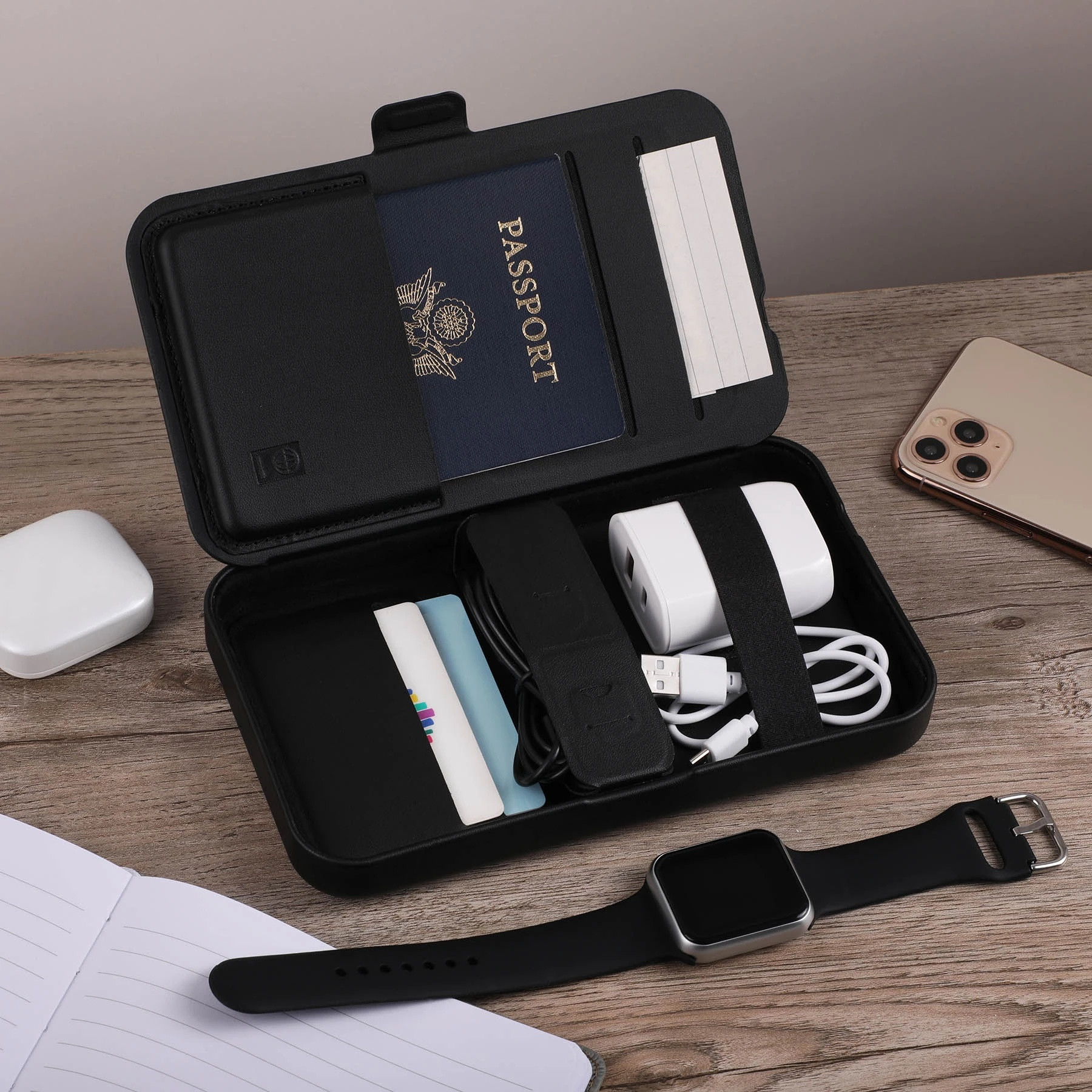 Wireless charging for phone, earbuds, and watch; hard shell carrying case; magnetic lid closure; adjustable magnetic dividers; magnetic lid doubles as a stand