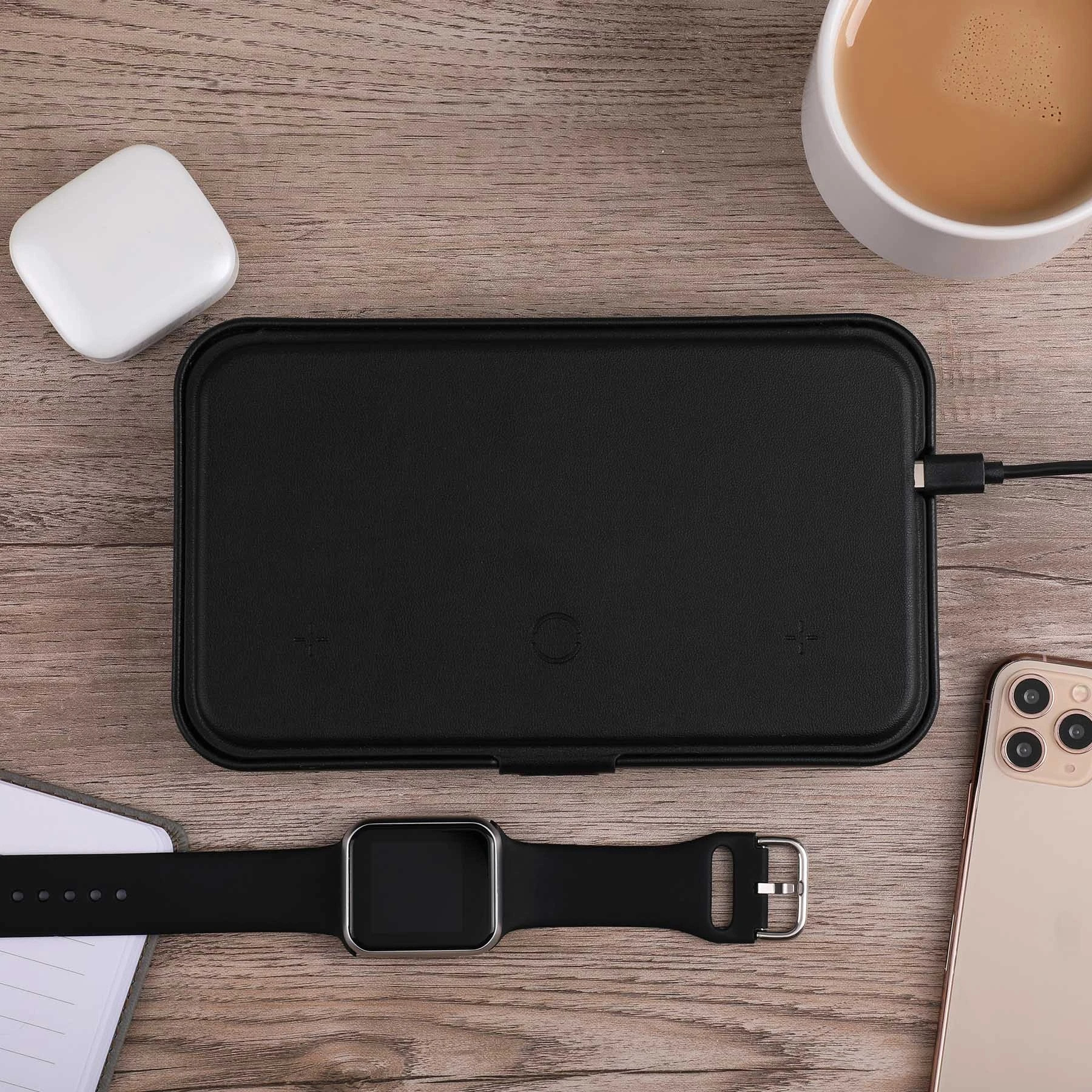 Wireless charging for phone, earbuds, and watch; hard shell carrying case; magnetic lid closure; adjustable magnetic dividers; magnetic lid doubles as a stand