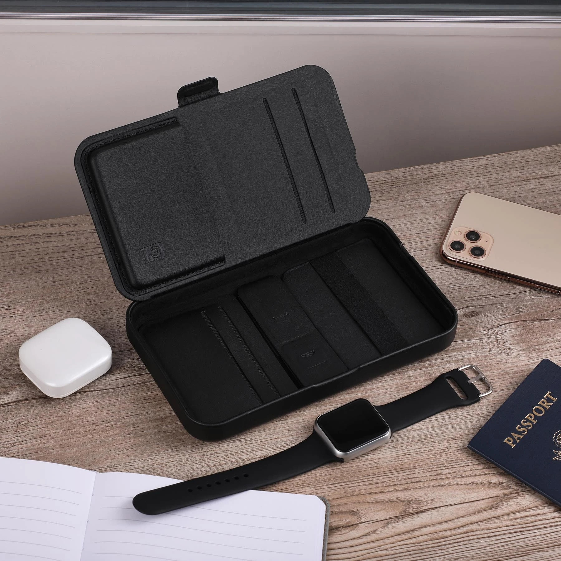 Wireless charging for phone, earbuds, and watch; hard shell carrying case; magnetic lid closure; adjustable magnetic dividers; magnetic lid doubles as a stand