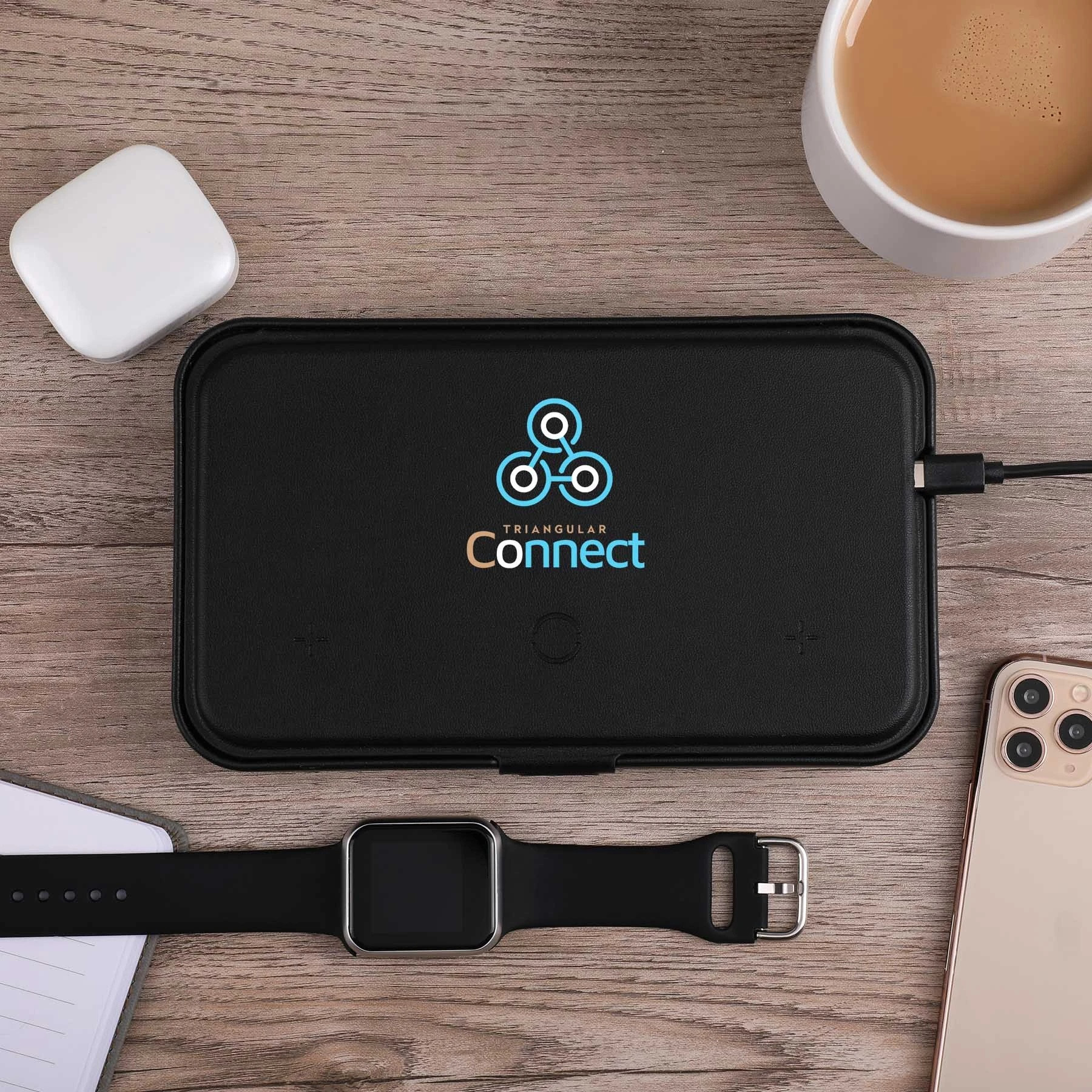 Wireless charging for phone, earbuds, and watch; hard shell carrying case; magnetic lid closure; adjustable magnetic dividers; magnetic lid doubles as a stand