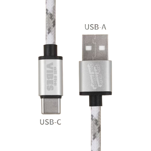 Person using a recycled-material Gomi charging cable to fast charge a device, featuring a durable braided exterior and aluminum connector heads.