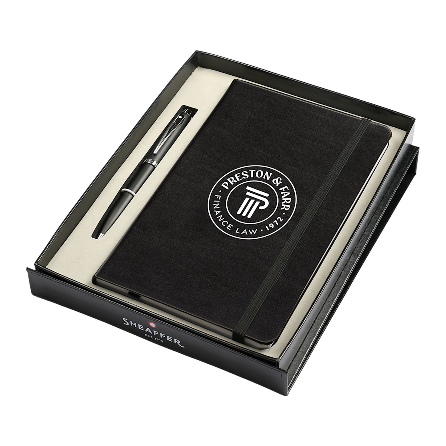 Black Sheaffer notebook and ballpoint pen gift set featuring a matte black pen, lined notebook, ribbon detail, and premium gift box.