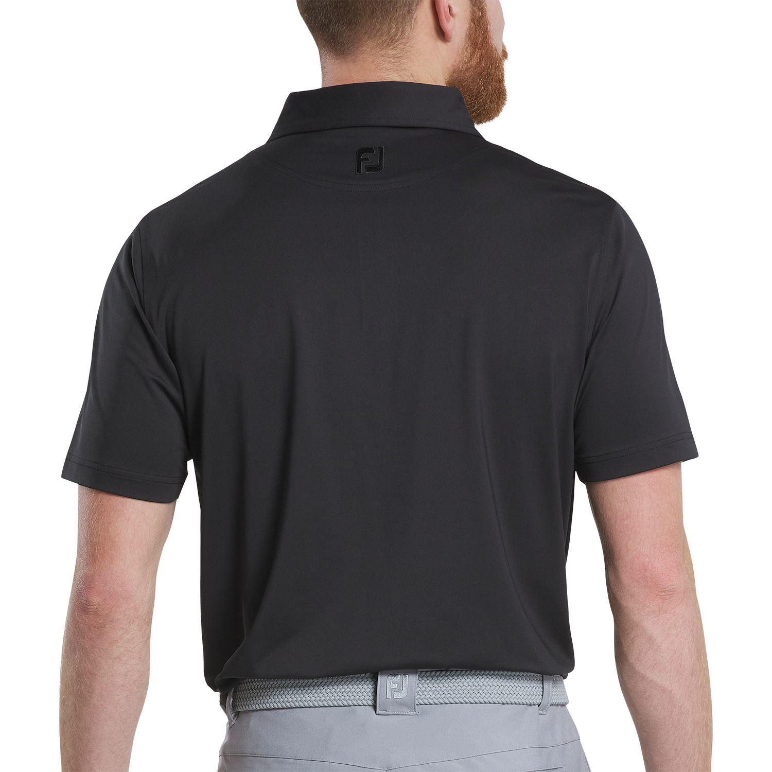 Black FootJoy men's solid performance golf polo made from an 88% polyester and 12% spandex blend with moisture-wicking technology, four-way stretch, anti-microbial treatment, and a polished lisle knit finish.