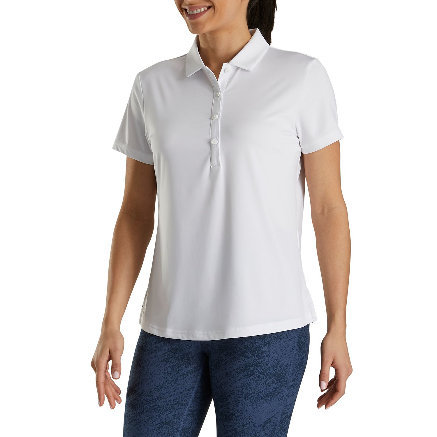White FootJoy Women’s Solid Lisle Performance Golf Polo made from stretch polyester-spandex fabric with moisture-wicking technology, anti-microbial finish, four-way stretch, and extended back shirt tail for golf or active wear.