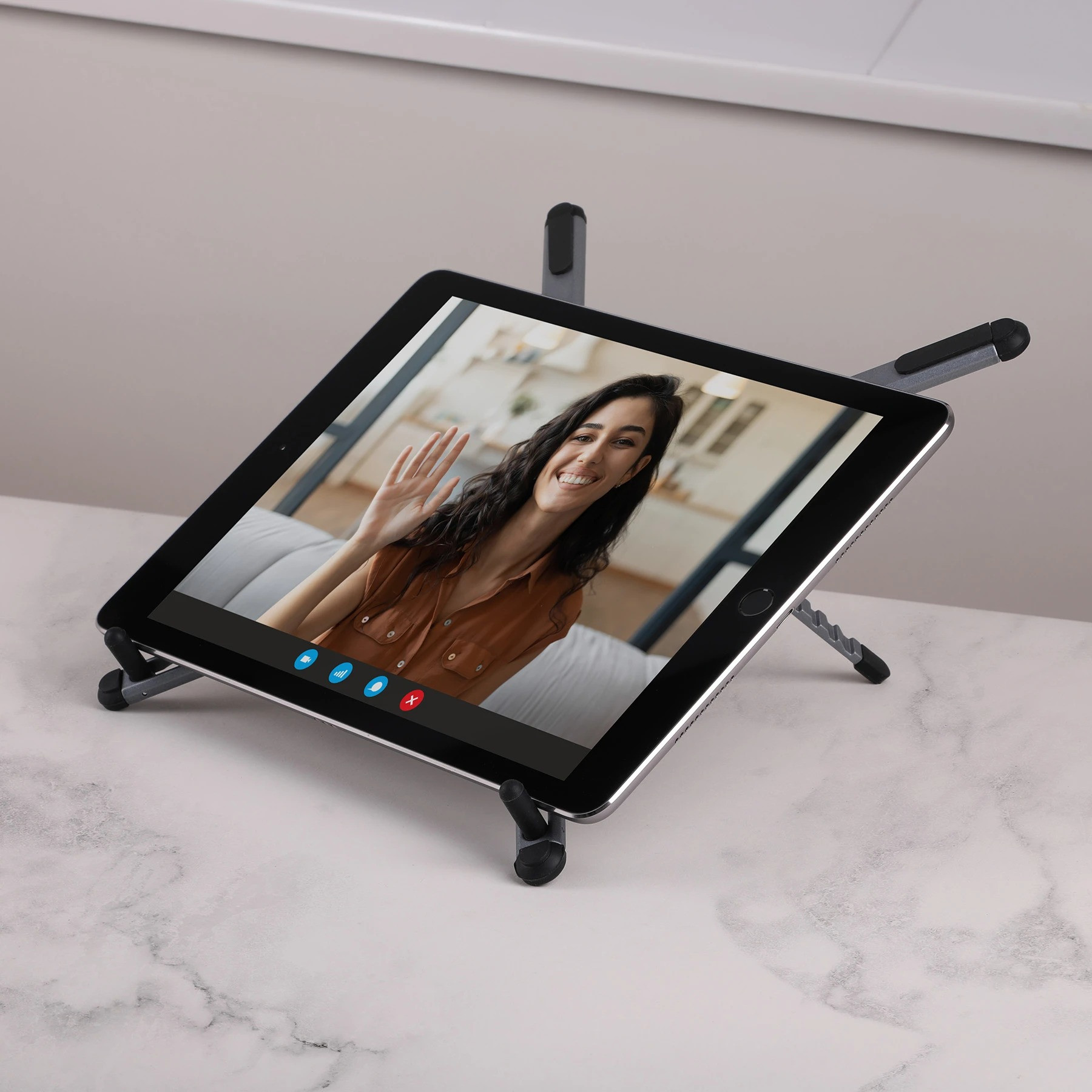 Gray Magnix Portable Travel Laptop Stand Compact, adjustable laptop stand with sleek metal legs and a magnetic phone mount, shown in a modern metallic finish. Folds flat for easy travel and supports laptops, tablets, and phones for portable workspaces.