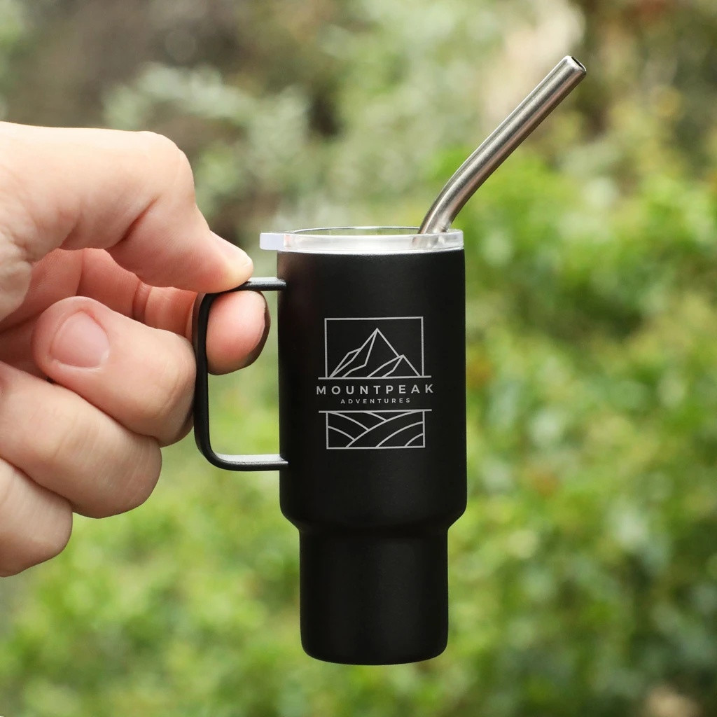 Black mini stainless steel tumbler with a clear plastic lid and metal straw, designed for shots, espresso, small beverages, party favors, and promotional giveaways.