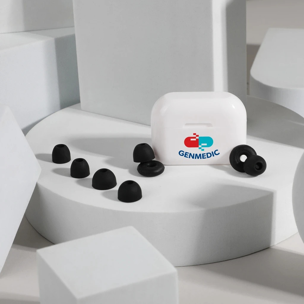 White and black loop-style silicone earplugs with a recycled plastic storage case and replacement ear tips for comfortable travel, studying, relaxation, and sleep.