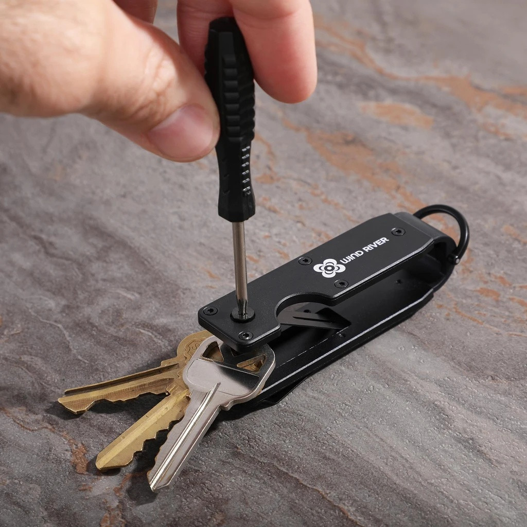 Black aluminum key organizer designed to hold 2-6 keys in a compact configuration, featuring a sleek minimalist design for reducing key bulk and noise.