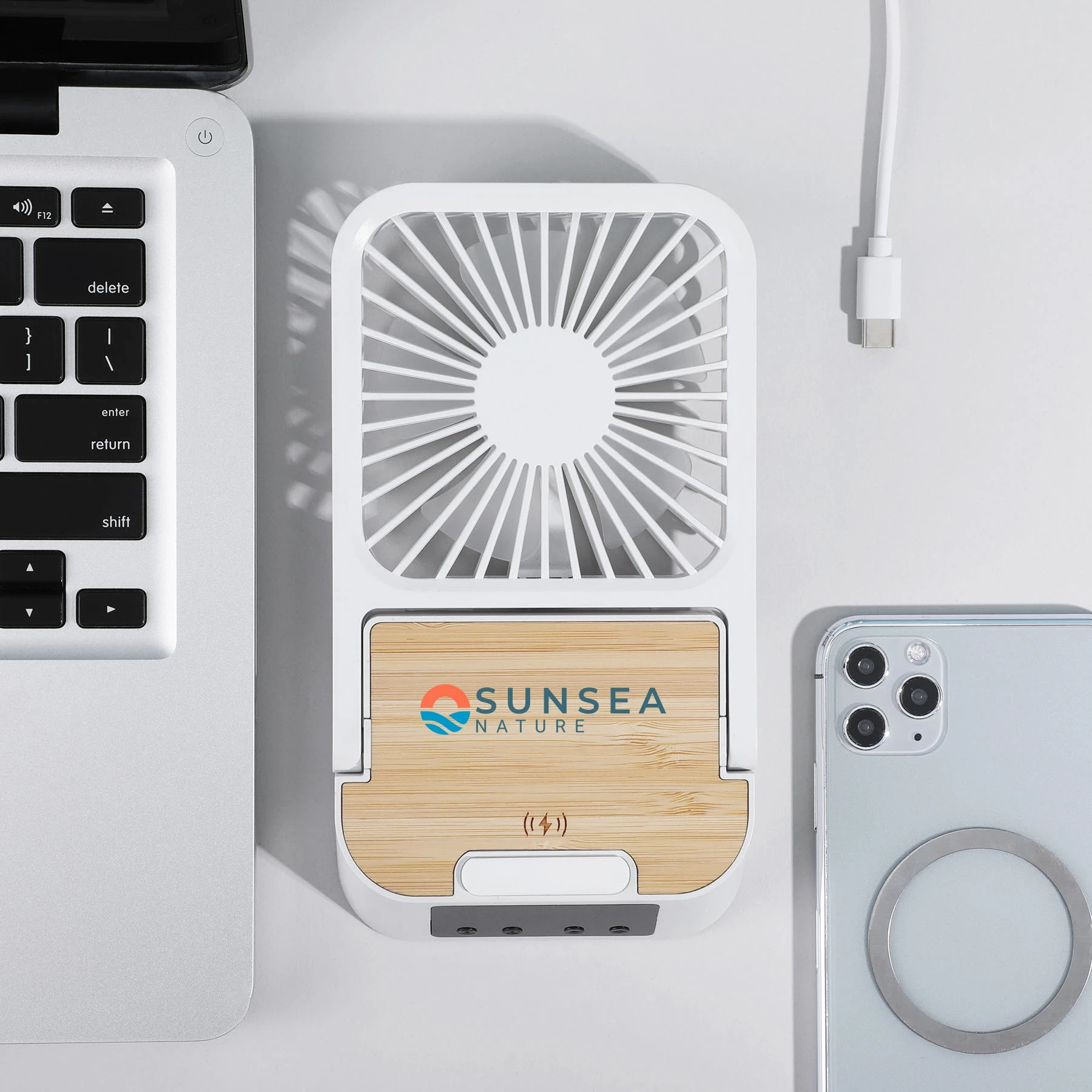 Natural Bamboo/White Cool & Connect 4-in-1 Desk Fan in a compact desktop design with three fan speeds, built-in wireless charging pad, digital clock and alarm display, and phone stand for cooling, charging, and hands-free viewing.