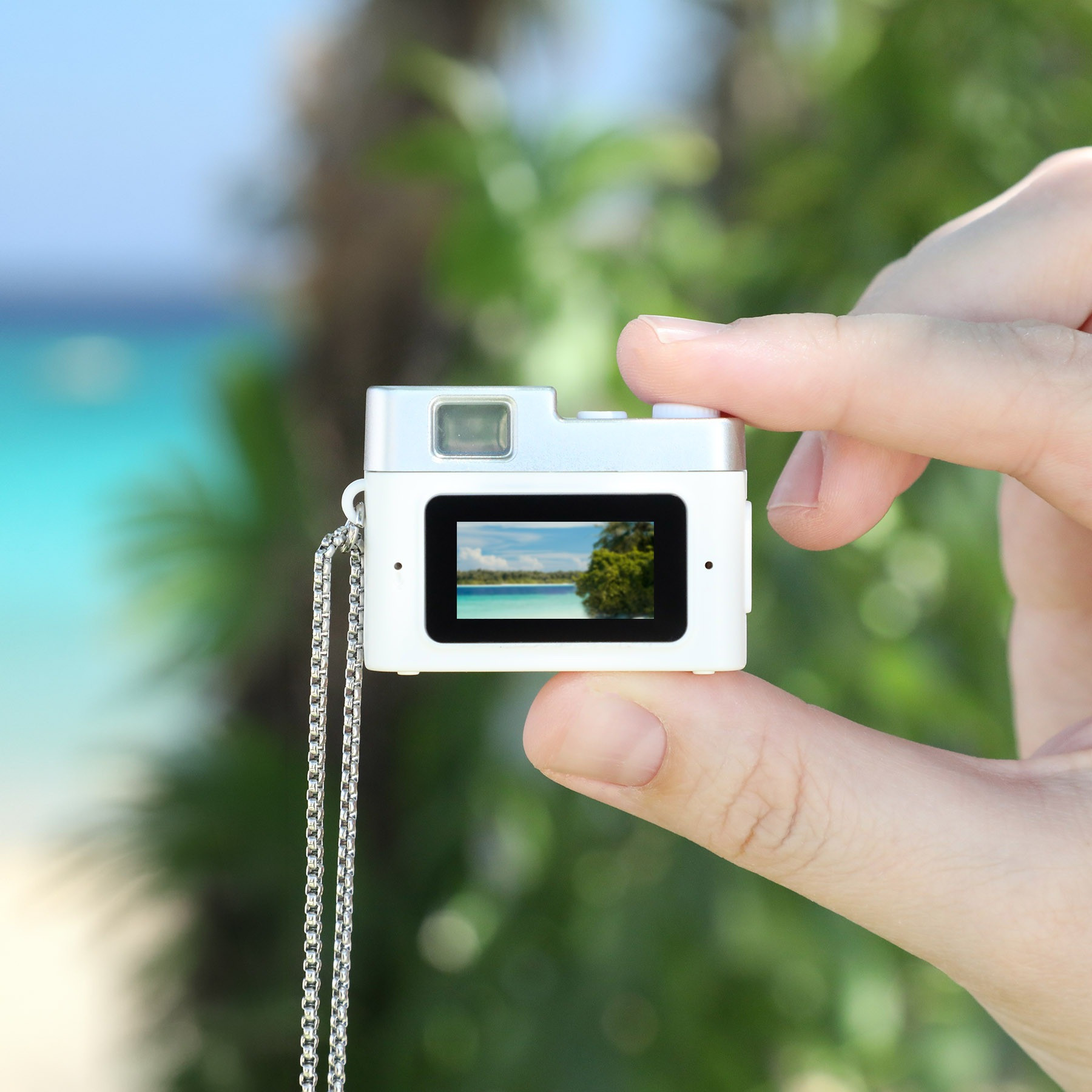 White Cutie Cam Mini Camera, compact portable camera with a fun mini design, featuring a small display and simple controls for capturing photos and 1080p video.