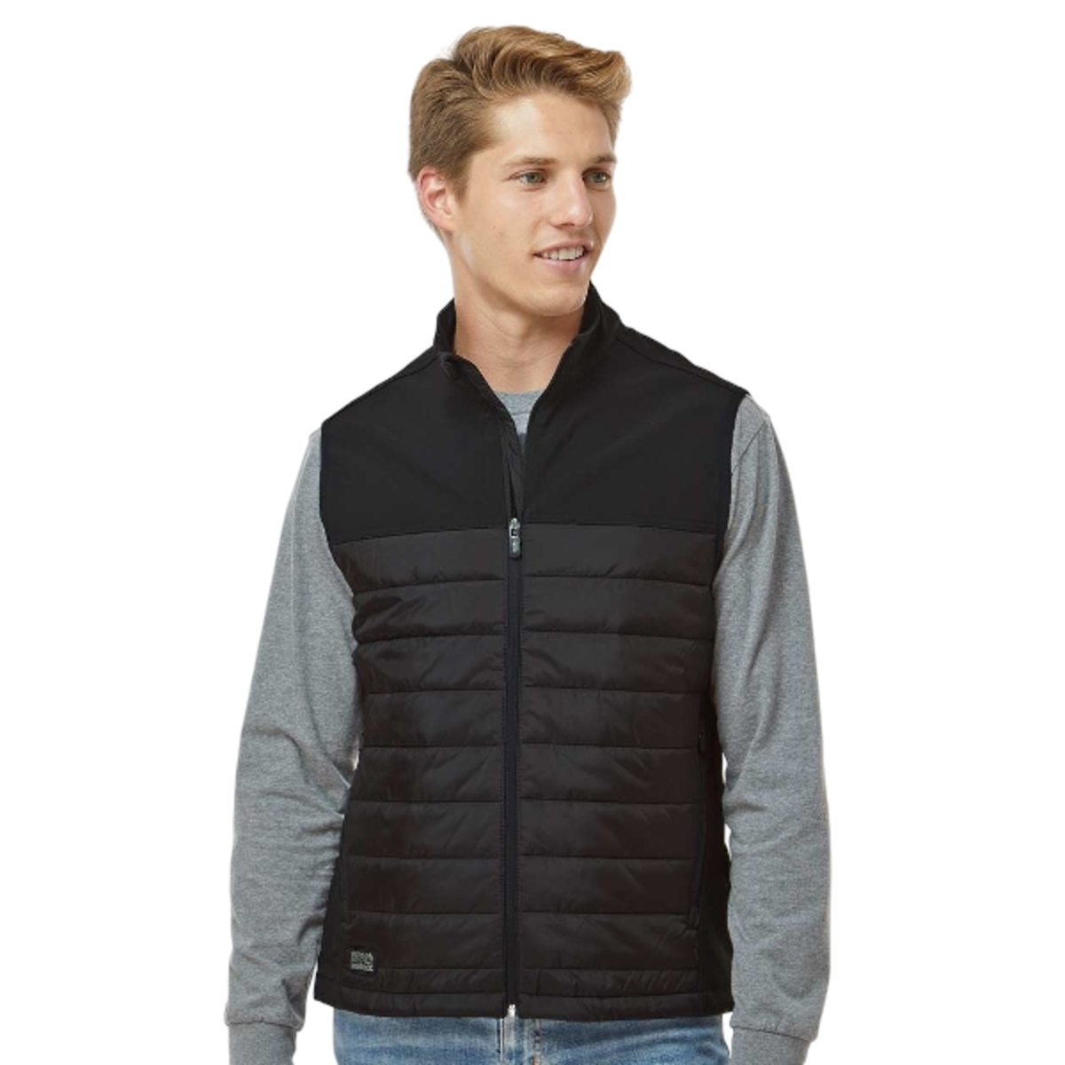 Hybrid softshell jacket with channel-quilted insulation, brushed tricot interior, water-resistant Storm Shield™ protection, zippered pockets, and adjustable droptail hem.