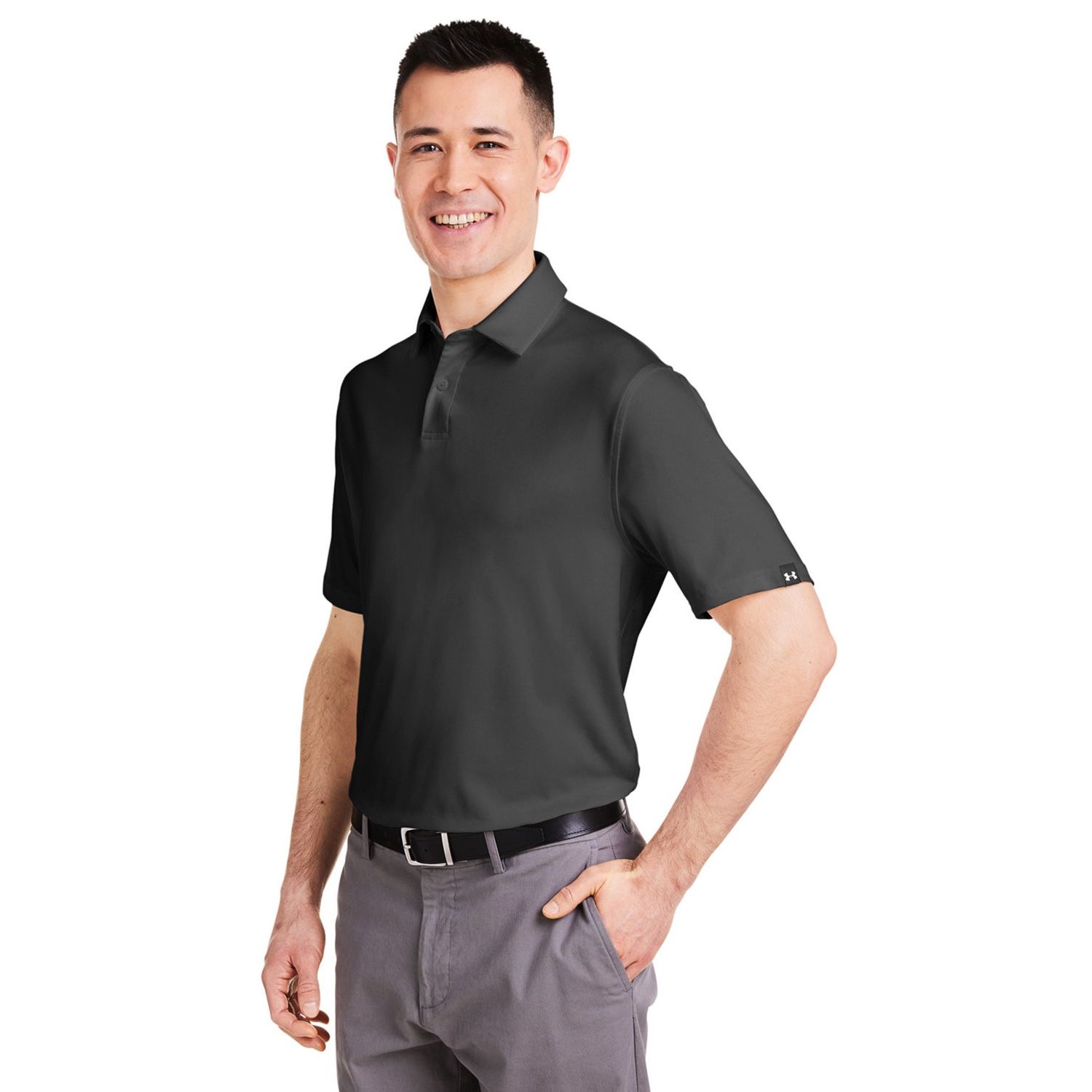 Black/White Under Armour Men’s Recycled Polo in a performance-style textured fabric, featuring a fuller fit, short sleeves, side-vent hem, contrast sleeve label, and center-back neck logo detail. Made from recycled polyester and elastane for a smooth, comfortable feel and moisture management.