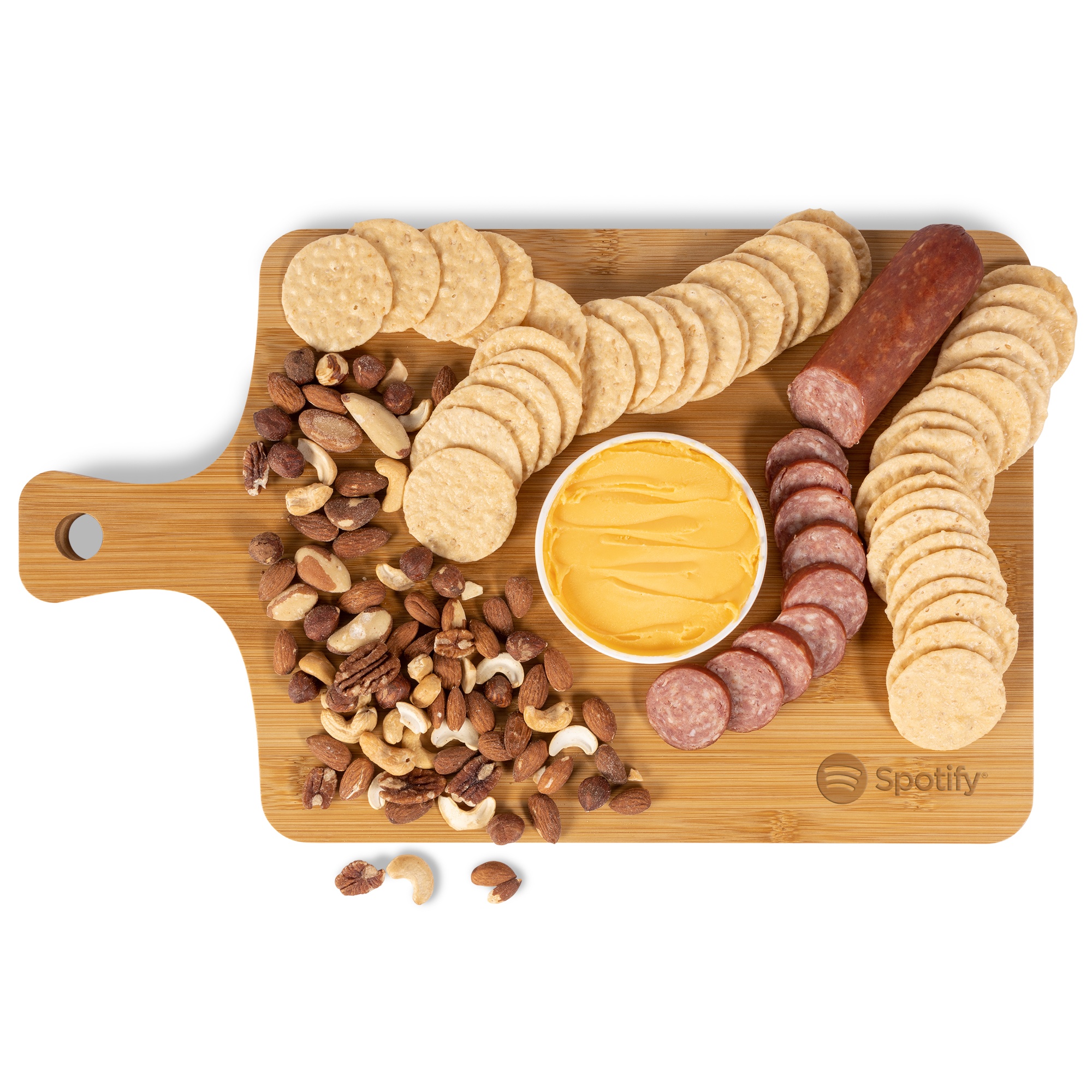 Wood bamboo charcuterie board with cheddar cheese spread, summer sausage, mixed salted nuts, and savory rice thin crackers, featuring a convenient handle for transport.