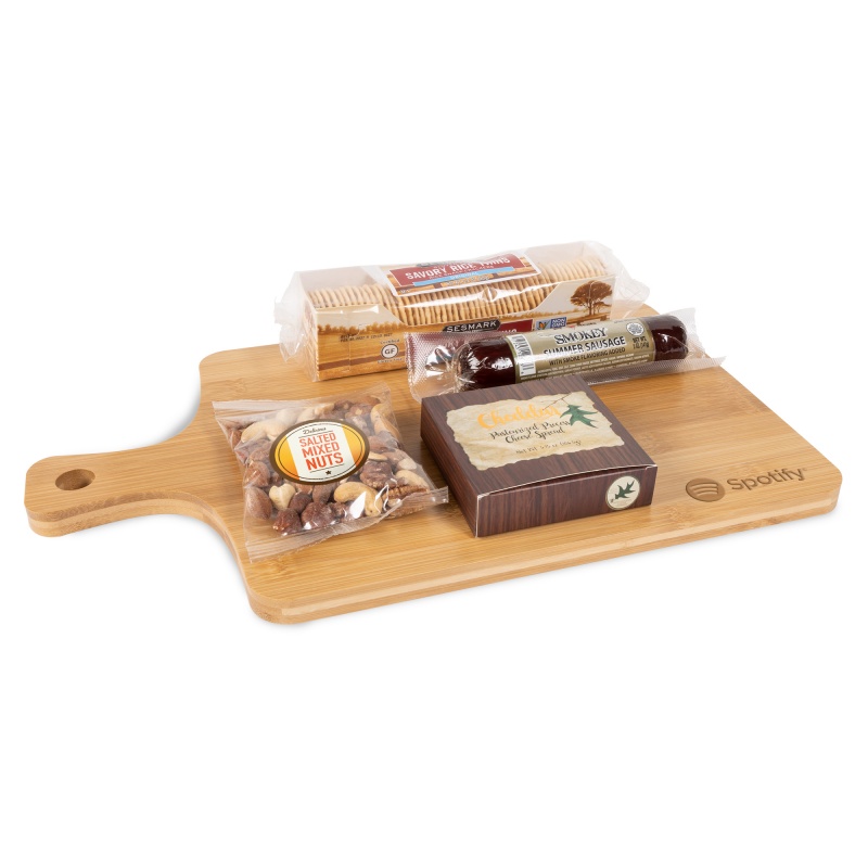 Wood bamboo charcuterie board with cheddar cheese spread, summer sausage, mixed salted nuts, and savory rice thin crackers, featuring a convenient handle for transport.