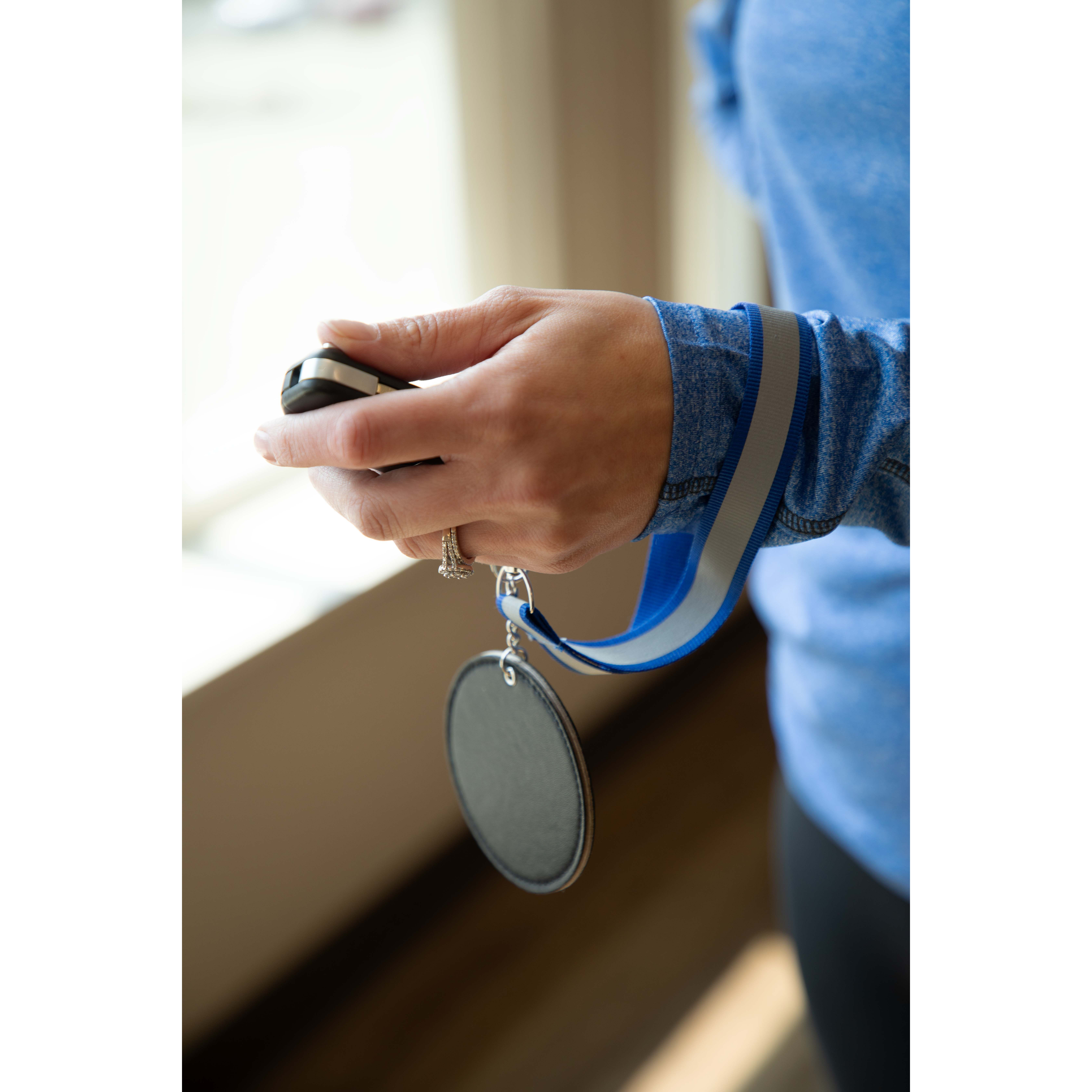Blue Reflective Recycled Wrist Lanyard made from 100% recycled polyester, featuring a reflective stripe and durable metal lobster clip for carrying keys, ID badges, and small accessories during commutes, walks, runs, and outdoor activities.