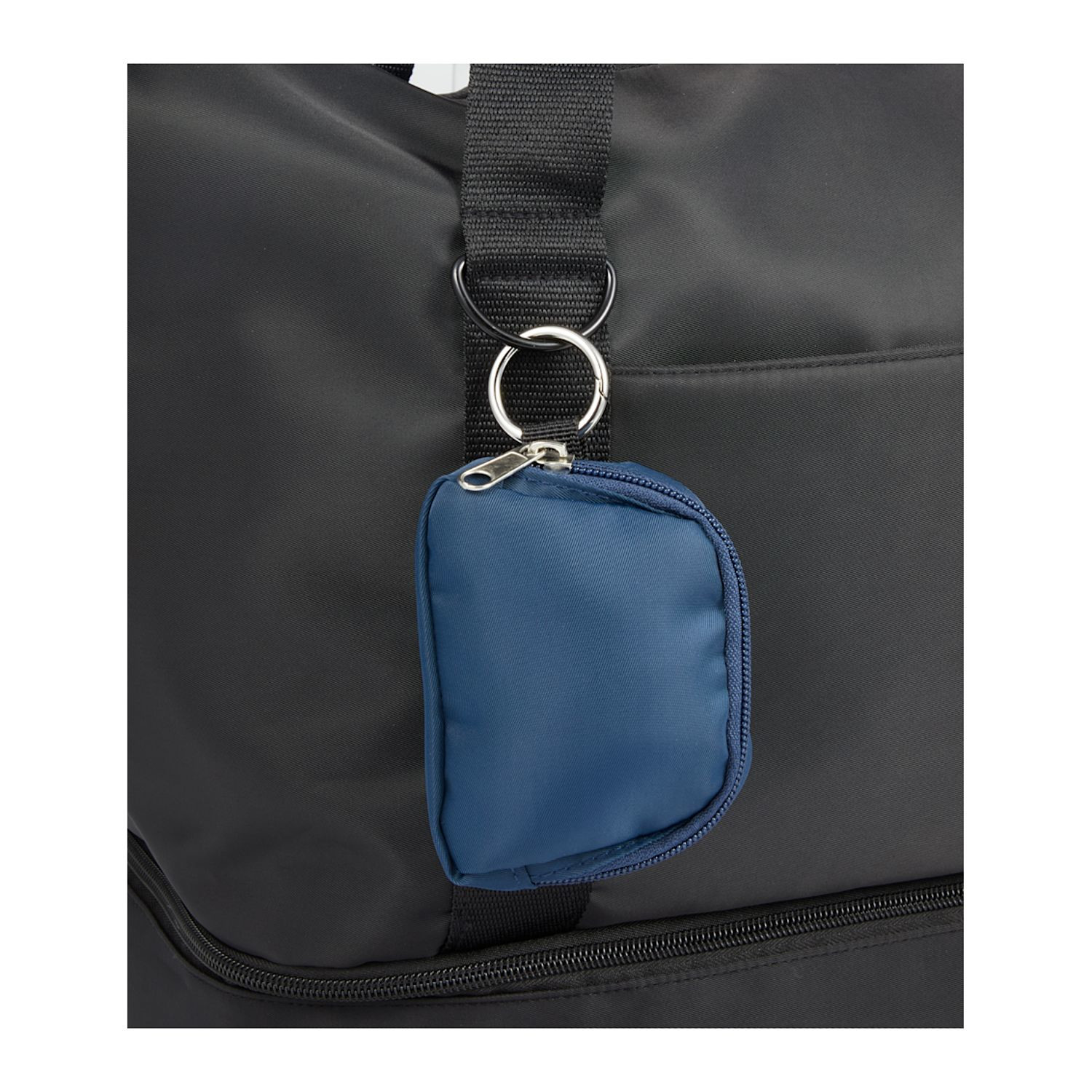 Navy mini sport wrist pack charm made from recycled 290T twill with a zippered top, open main compartment, wrist strap, and round carabiner for carrying small essentials.