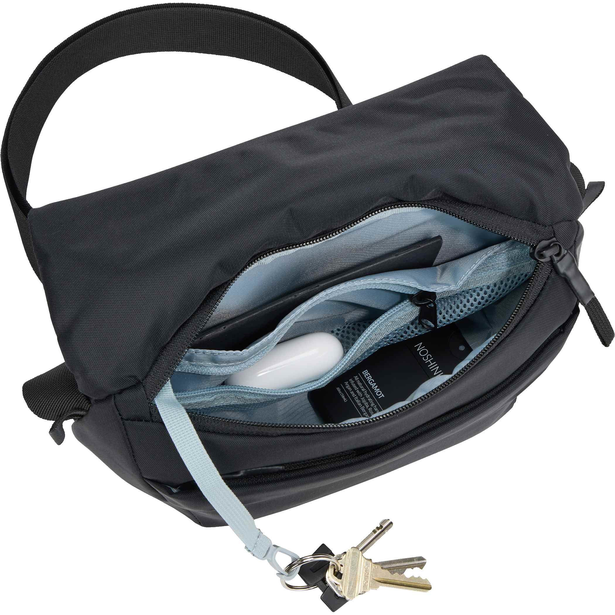 Black Compact 2L sling bag made from durable 400D nylon, featuring an adjustable strap with reflective details, a magnetic fold-over closure, multiple zippered compartments, and a breathable mesh back panel. Designed for hands-free everyday carry across the body or around the waist, with organized storage for essentials and an integrated key fob for convenience.