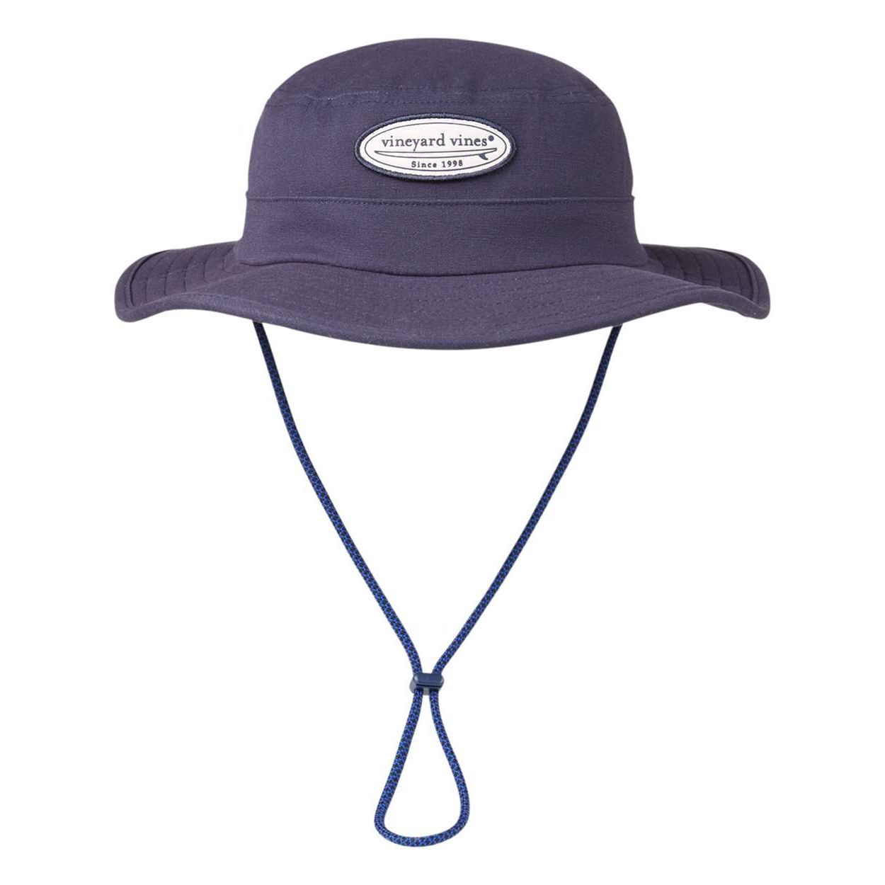 Vineyard Navy Vineyard Vines® Unisex Surf Patch Canvas Bucket Hat in cotton canvas, featuring a surf-inspired patch graphic, side ventilation grommets, a chin strap with plastic clip, and a whale logo label tab, designed for casual outdoor and beach wear.