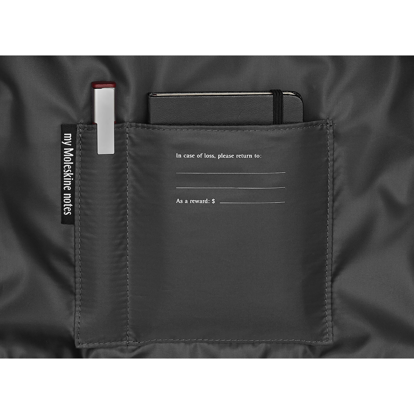 Slate Gray Moleskine® Notebook Backpack in a slim, sleek design, featuring a black water-resistant exterior, padded adjustable shoulder straps, breathable mesh back, and multiple zippered and interior pockets for organizing a laptop, tablet, notebooks, pens, and travel essentials.