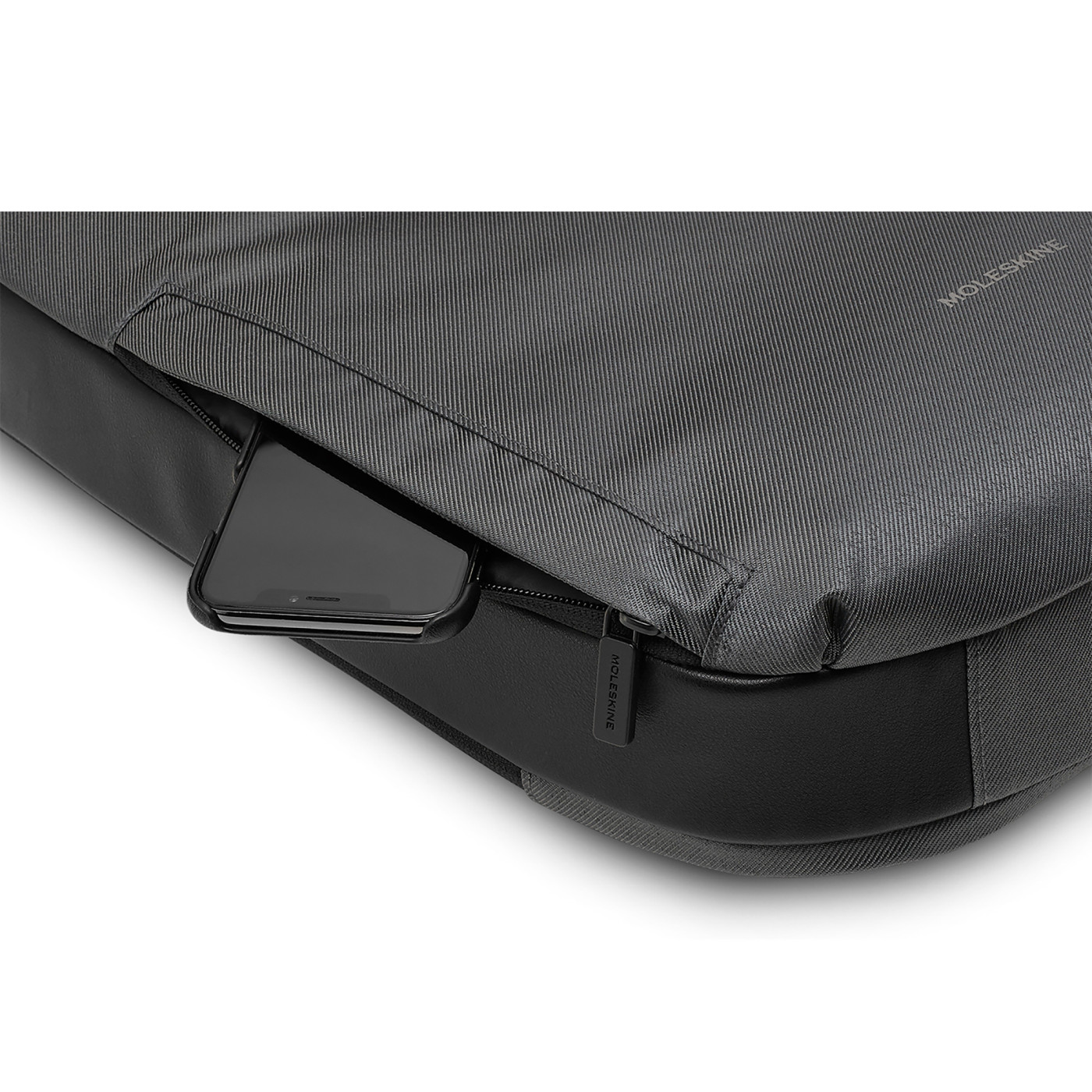 Slate Gray Moleskine® Notebook Backpack in a slim, sleek design, featuring a black water-resistant exterior, padded adjustable shoulder straps, breathable mesh back, and multiple zippered and interior pockets for organizing a laptop, tablet, notebooks, pens, and travel essentials.