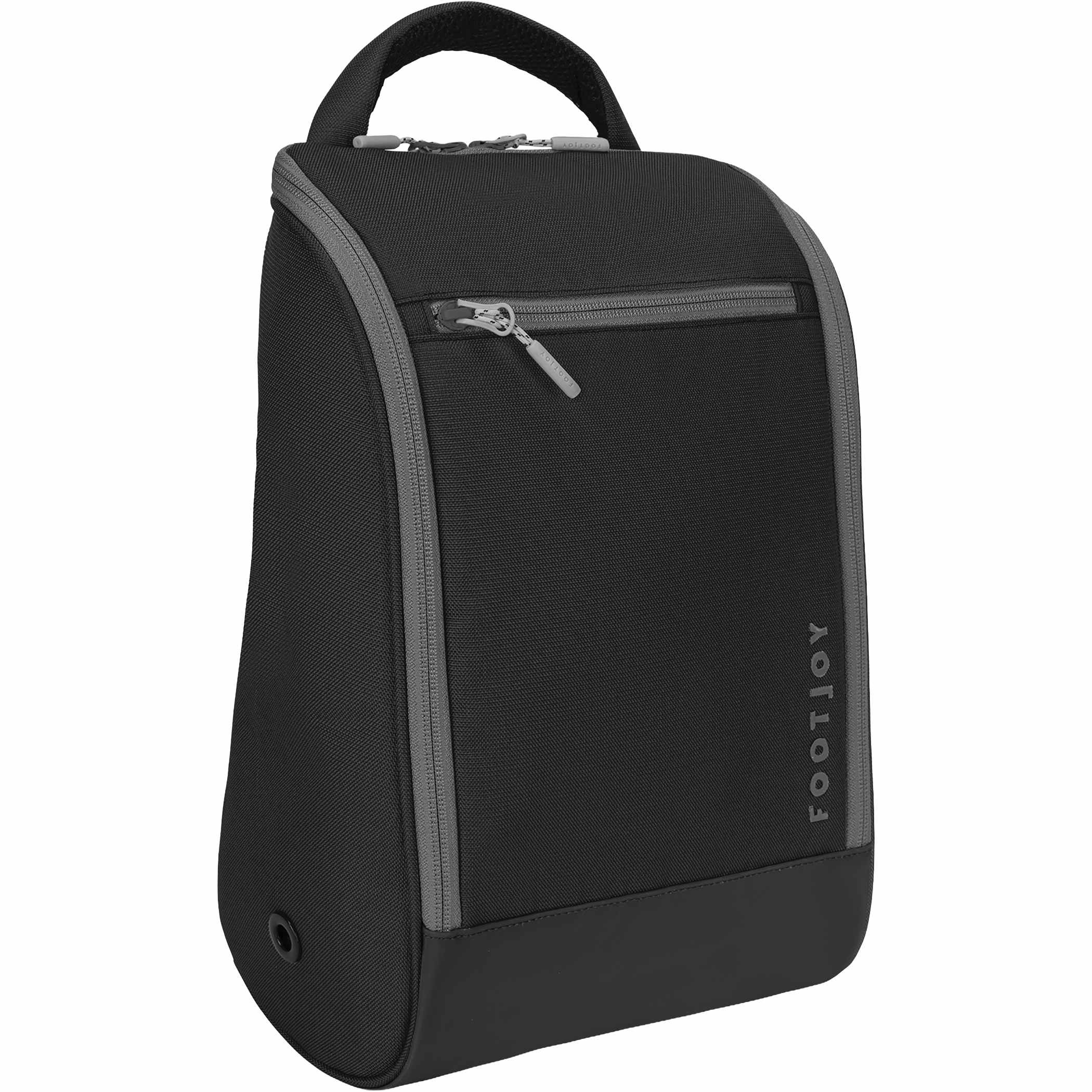 Black FootJoy® Deluxe Shoe Bag featuring a spacious zippered main compartment, exterior zippered accessory pocket, side ventilation panels, and padded carry handle. Designed to organize and transport golf shoes, with interior mesh storage and a divider to help keep footwear separate during travel or golf outings.