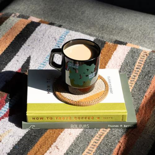 vintage-inspired glass mug with a curved handle, classic milk glass finish, and 8 oz capacity for coffee, tea, and other hot or cold beverages.